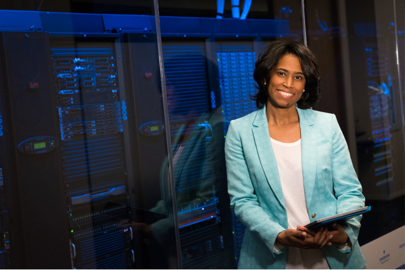 Cloud consultant standing in a modern data center server room