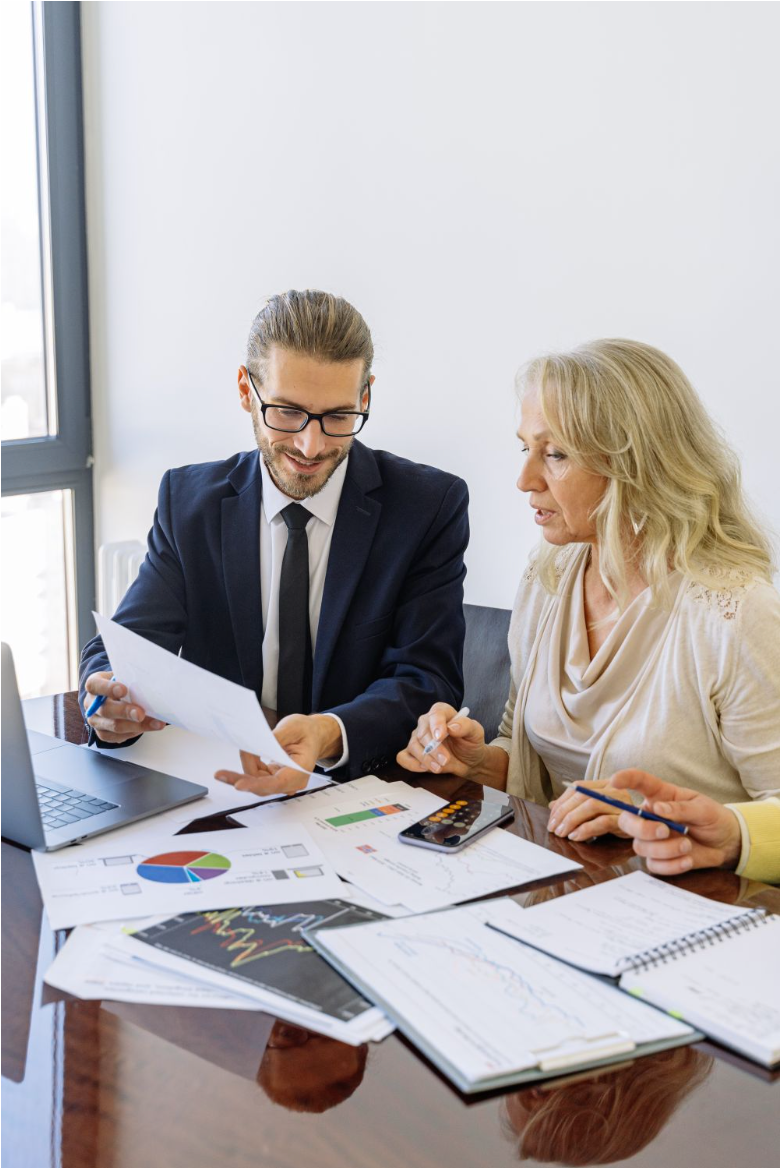 Ascension America advisor and client reviewing financial charts and reports