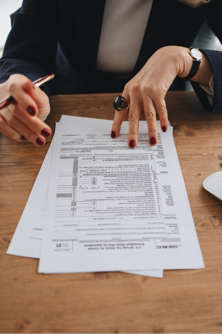 Advisor pointing to figures on a completed tax return form